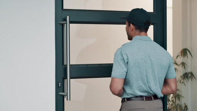 Delivery man, box and front door for courier service, distribution or logistics with knock for arrival. Back of industry worker with package, mail and order at house or home for commerce supply chain