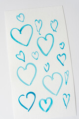 blue heart outlines on paper