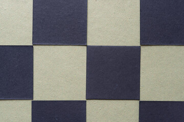 blank checkered background composed of black tiles on green paper