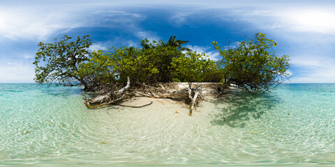 Clear ocean water over white sand beach in Mantigue Island. Blue sky and clouds. Camiguin, Philippines. VR 360.