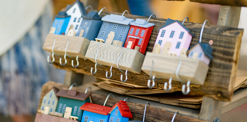 Wooden decorative key holder houses sold on annual Nations Fair, where masters from the national...