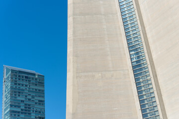 Obraz premium detail of recently constructed tower (at left) and CN Tower (elevator car) in Toronto, Canada
