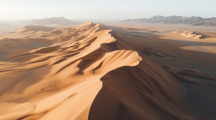 Fototapeta na wymiar Majestic sunrise illuminating sand dunes with mountain backdrop