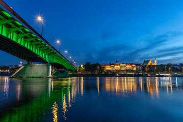 evening view of the Warsaw embankment in Poland and the royal palace