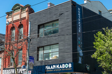 Obraz premium exterior building facade and sign of Naan Kabob, an Afghan restaurant located at 240 Queen Street West in Toronto, Canada