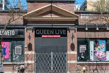 Obraz premium shuttered Queen Live Fresh Food Market facade located at 238 Queen Street West in Toronto, Canada