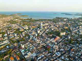 Aerial view of residential houses and driveways neighborhood during a fall sunset or sunrise...