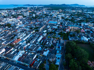 Aerial view of residential houses and driveways neighborhood during a fall sunset or sunrise time.Tightly packed homes.Top view over building houses in phuket thailand