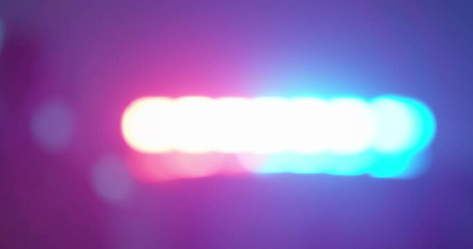 Out of focus crime scene, police flashers on emergency vehicles, police, Emergency Situations, utilities. Flashing light red and blue.