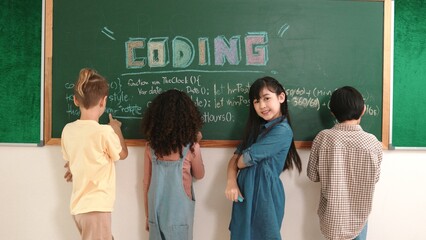 Back view of multicultural student writing prompt at board while skilled girl looking at camera...