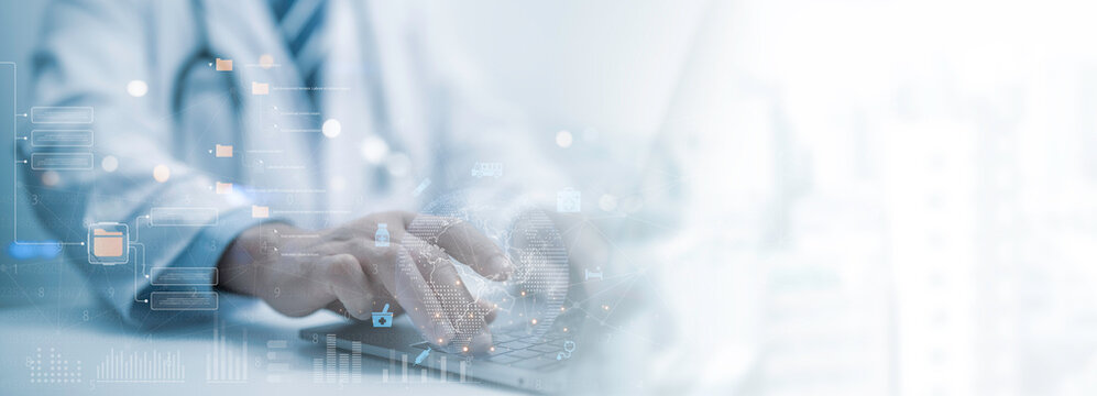 Medical worker work with electronic medical record of patient on laptop. Concept Digital healthcare and network connection on hologram virtual interface, Medical technology and data digital network.