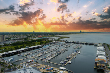 aerial shot of boats and yachts docked on the ocean water at the Southern Yacht Club with blue sky...