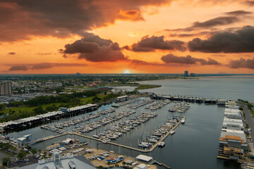 aerial shot of boats and yachts docked on the ocean water at the Southern Yacht Club with powerful...