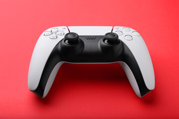 One wireless game controller on red background