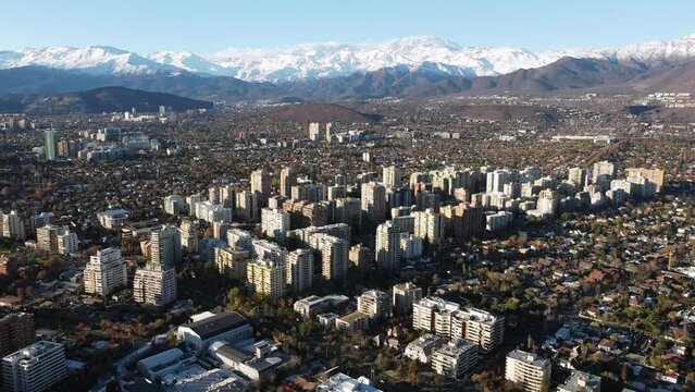 Aerial View of Santiago de Chile City with the Andes Mountains in the Background. 4K Resolution.