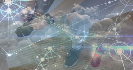 Image of network of connections over woman tying shoe laces and clouds