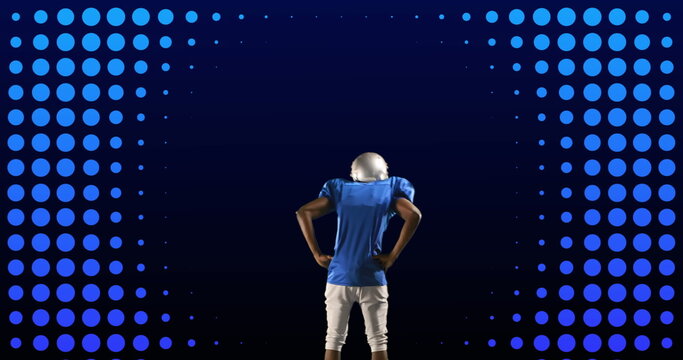 Image of rear view of american football player, over moving neon blue rings and blue circles