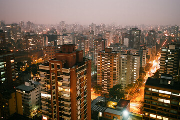 Fototapeta premium Night view of the cityscape, tall buildings and urban development, aerial, drone