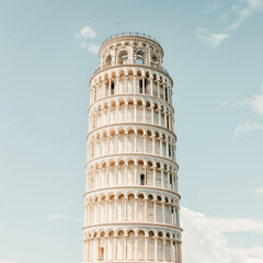 Iconic Leaning Tower of Pisa Against Blue Sky