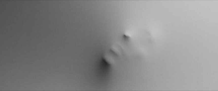 The shape of the woman's face extrudes from the wall 