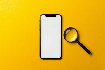 Cell phone with magnifying glass on yellow background with copy space