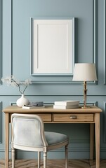 A blank picture frame sitting on top of an empty desk, light blue wall with white trim, soft lighting from a lamp above the chair, light wood color, modern French country style interior design