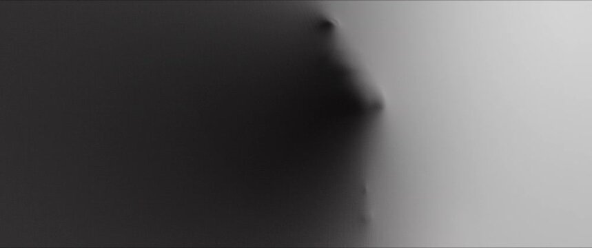A woman's face and hands appear from the wall surface 