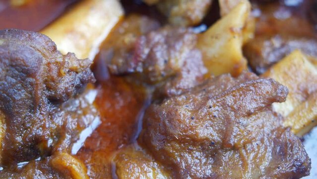 traditional Indian curry lamb masala in a bowl on table 