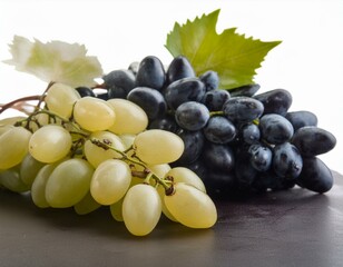 Mix of grapes with leaves isolated on the white background