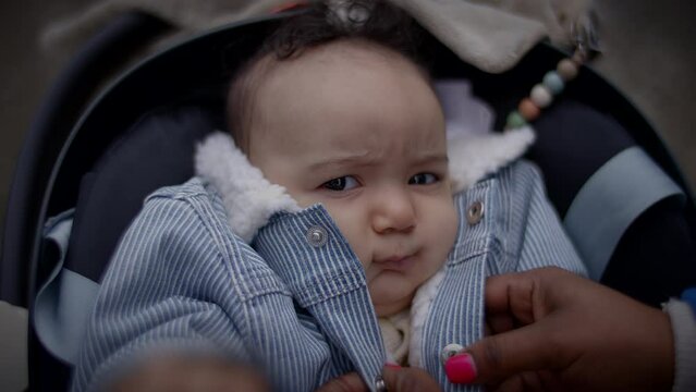 Young Baby Boy Lying in pram buggy Waking up after Sleeping