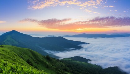 green mountain with fog and sunrise twilight sky at background