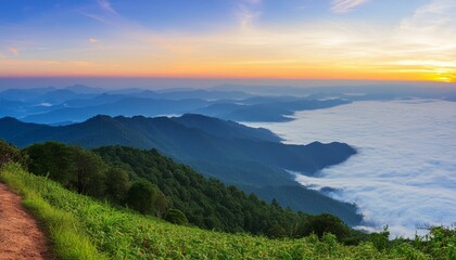green mountain with fog and sunrise twilight sky at background