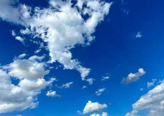 Beautiful nature background with blue sky and fluffy white clouds. Blue sky with clouds.