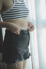 Women body fat belly. Obese woman hand holding excessive belly fat. diet lifestyle concept to...