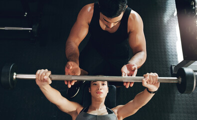 Fitness, bench press and woman with personal trainer for support, help and safety in gym workout....