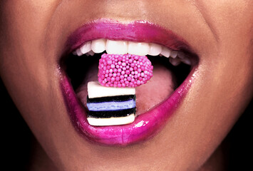 Eating, candy and woman with makeup for mouth, color and lipstick closeup. Skin, shine and girl...