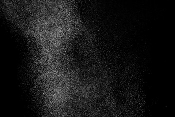 White texture on black backdrop. Abstract splashes of water on dark background. Light clouds...