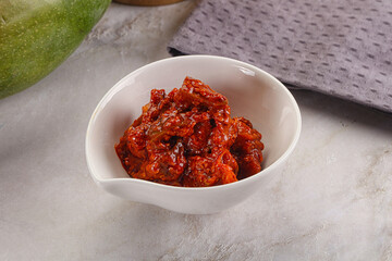 Spicy pickled raw green mango