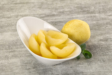 Canned yellow pear with syrup