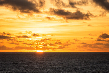 Beautiful, golden sunset over the calm ocean.