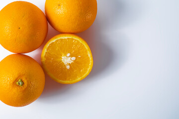Oranges on a white background with copy space for your text.