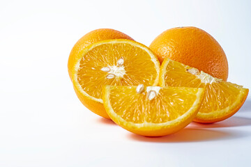 Orange fruit isolated on a white background cut in half with clipping path.
