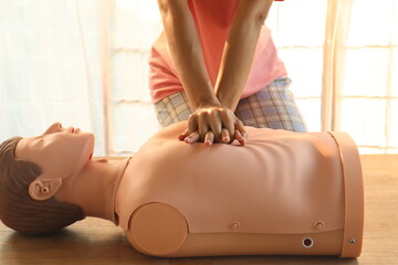 Close-up of CPR on doll's hand (Cardiopulmonary Resuscitation) A resuscitation technique used in...