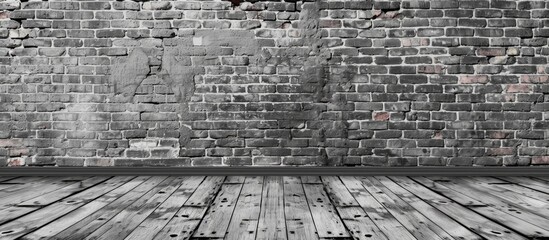 A textured grey brick wall and wooden floor interior background, adding rustic charm to architectural design