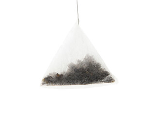 Pyramid fruit tea bag hanging from a string. Isolated with white background.