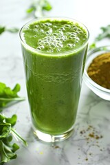 Close up of a healthy green juice made with plants and ingredients on a table