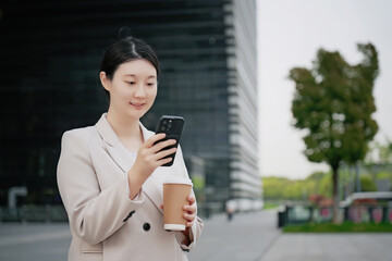 Professional Woman Checking Smartphone on Coffee Break