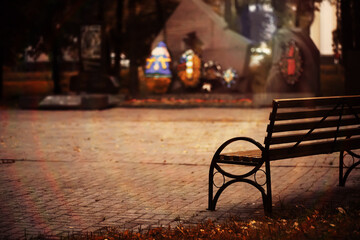 Autumn park bench, rainy texture background. Rain in autumn park, drops of water, wind.