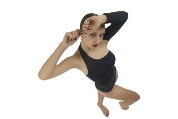 young female dancer in a bodysuit shows elements of choreography with her hands above her head top view