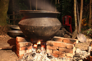 overnight cooking in a village party on a temporary brick made oven. Outdoor cooking for lots of...